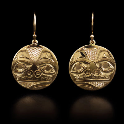These bear earrings are circular in shape and each one has the face of a bear looking straight ahead.
