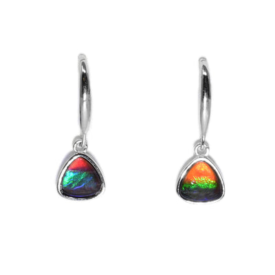 These ammolite earrings are in the shape of small triangles. The earrings have a mix of orange, yellow, green, blue, purple, and red colours.