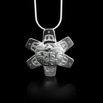 Sterling silver pendant depicting the Sun with 6 symmetrical rays. The sun has a face in the center of the pendant.