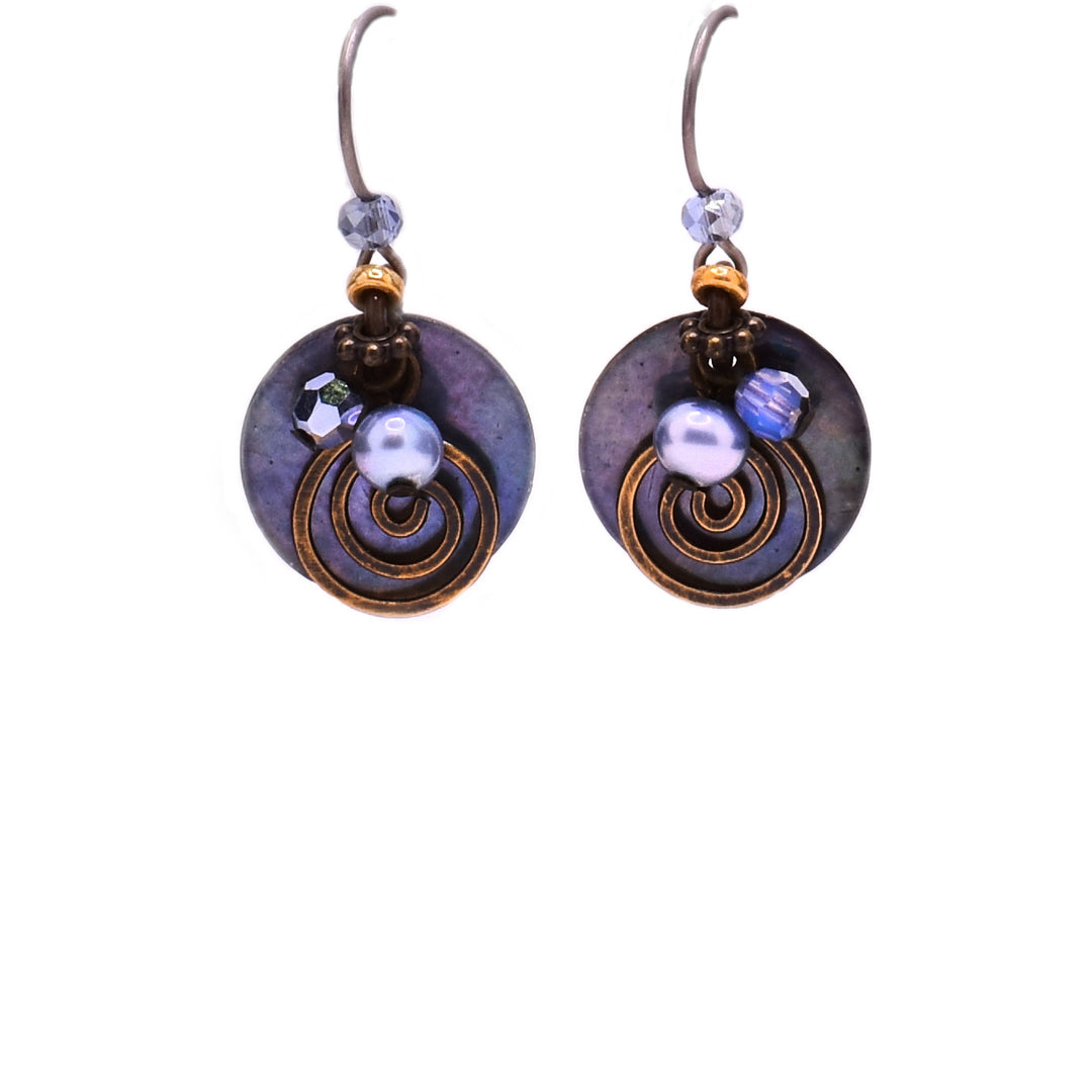 These shell earrings feature a circular blue shell with a brass spiral in front and a blue pearl and glass above. Attached to the hook is a blue Swarovski crystal.
