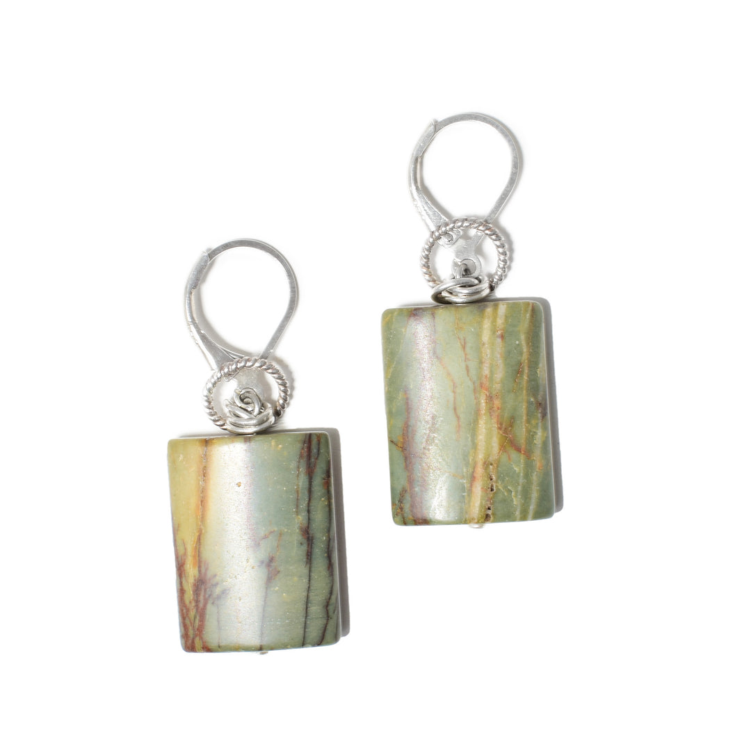 These genuine jasper earrings have chunky square shaped gems that make up the hangs. above them are textured, sterling silver hoops that are linked between the hangs and the sterling silver, lever back hooks.