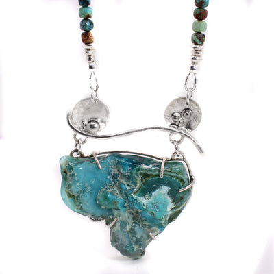 Abstract sterling silver chrysocolla bib style necklace with turquoise beads. By Johanne Rousseau.