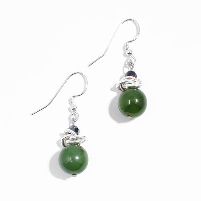 Sterling silver BC jade earrings with interlocking hoops adornments and dark blue crystals.