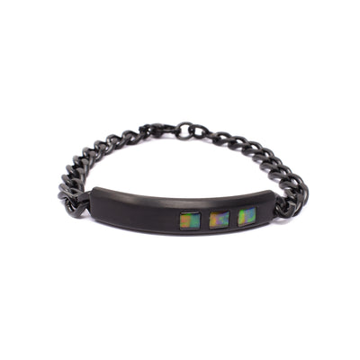 Black titanium chain bracelet with rounded bar across the front. Bar has three squares of A grade ammolite along the left side. Made by Korite International.