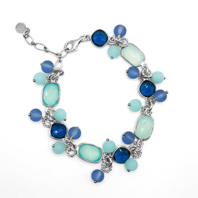 Sterling silver chain bracelet with dark blue crystal, blue chalcedony and blue glass. 7” long with 1” extension.