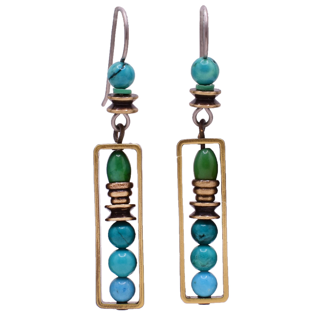 Dangle jade earrings made of turquoise, magnesite and handworked brass. Titanium ear hooks. By Honica.