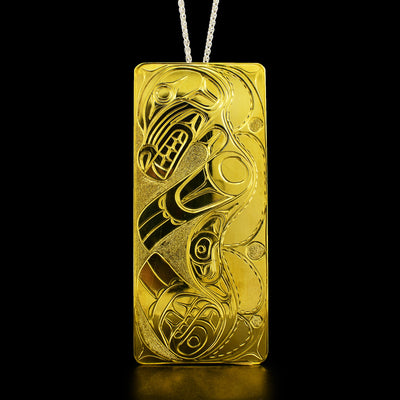 This big brass pendant has the shape of a rectangle and depicts the full body of a sea lion.