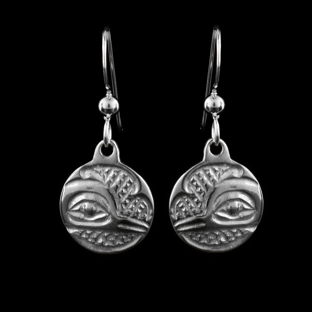 These sterling silver dangle Hummingbird earrings have small, circle hangs dangling from long hooks. The hangs depict the side profile of the head of the Hummingbird with cross hatching designs in the background.