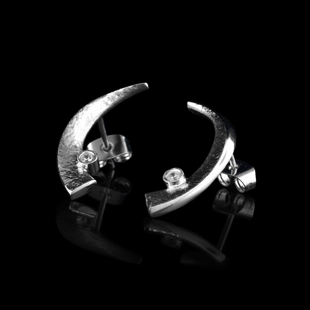 Crescent Sterling Silver Earrings, they also have small cubic zirconia in at the end of the earring.