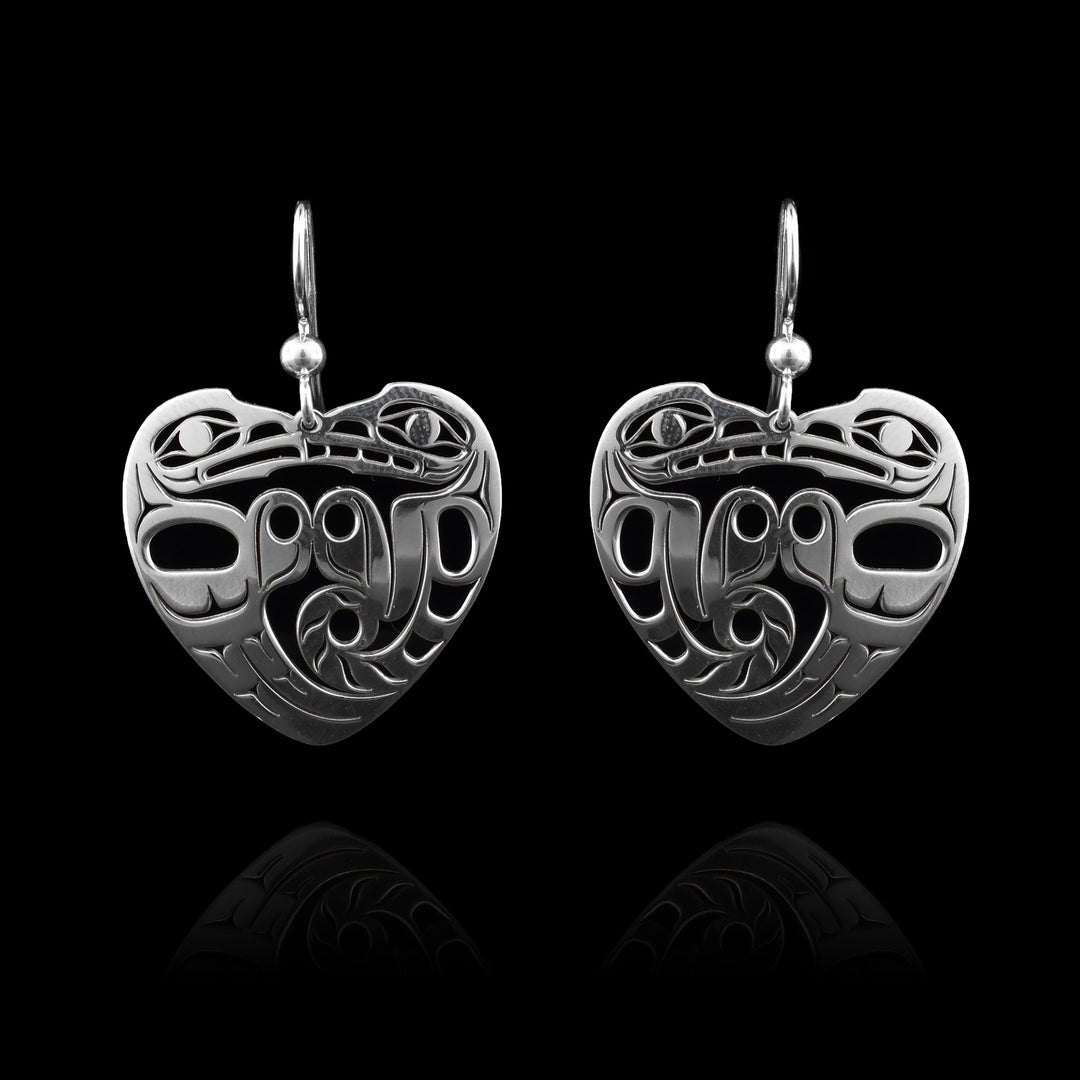 Eagle and Wolf Heart Dangle Earrings. Made with sterling silver and crafted into a beautiful heart. The Wolf and Eagle embrace each other in shape.