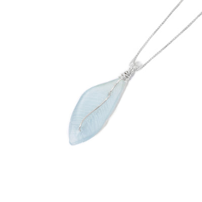 Light blue sea glass feather pendant with sterling silver wire down middle hangs from dainty sterling silver box chain.