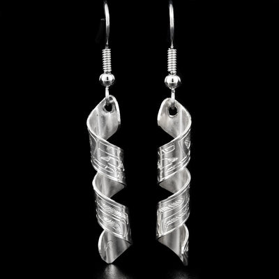 These spiral earrings are made out of a flat piece of sterling silver on which the Bear is depicted. The narrow piece of silver is then coiled to give it its spiral shape.