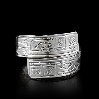 The two ends of this sterling silver wrap ring overlap in the front. Both ends of the ring have a face of the Bear carved on it.