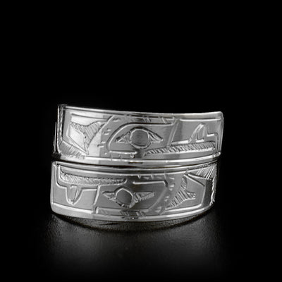 The two ends of this sterling silver wrap ring overlap in the front. Both ends of the ring have a face of the Eagle carved on it.