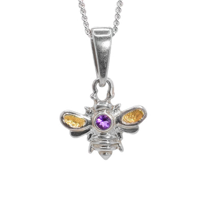Sterling silver bee pendant with 22K gold nuggets in wings. Round, faceted amethyst set on back. Sterling silver bail. By Tom Gregorczyk.