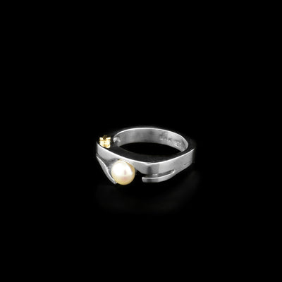 Sterling silver ring with white freshwater pearl and dainty 14K yellow gold bolt adornment. By Ivan Dobren.