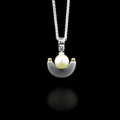 Sterling silver white freshwater pearl pendant with 14K yellow gold adornments. Abstract design. By Ivan Dobren.