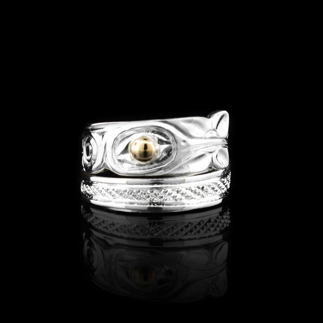 Elegant sterling silver and 14k gold band ring featuring a hand-carved hummingbird design. The 14k gold is used for the eye of the hummingbird.