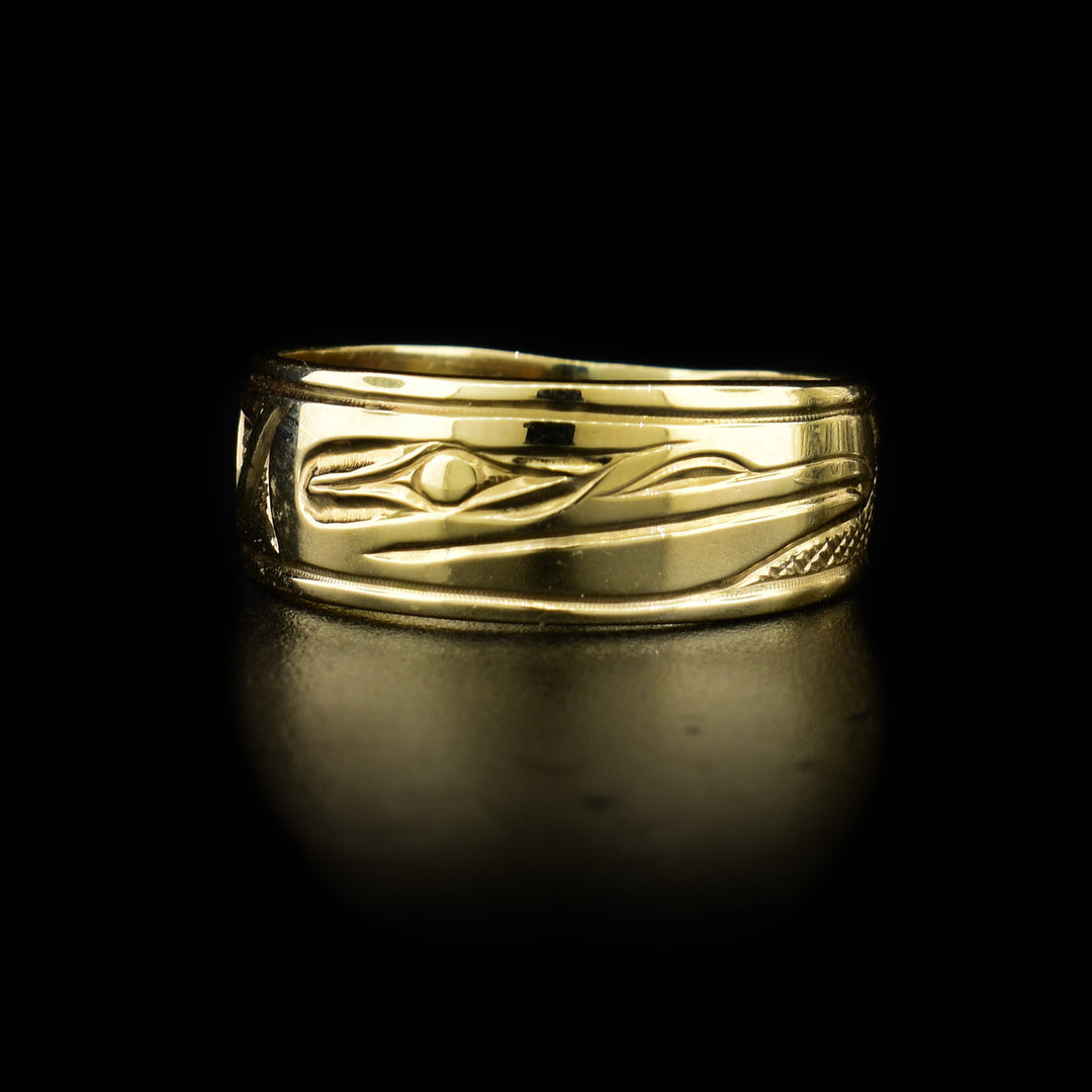 This 14K gold Raven ring has a single band and a depiction of the Raven carved into the surface of the band.