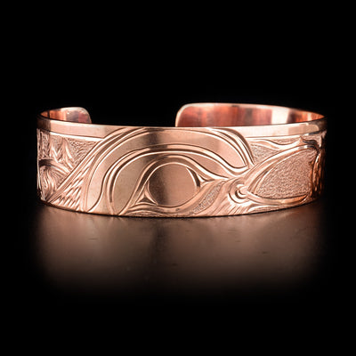 Bracelet features a sparrow picking berries. 7.13” long, 1” gap, 0.75” wide. Hand-carved by Kwakwaka’wakw artist Cristiano Bruno.