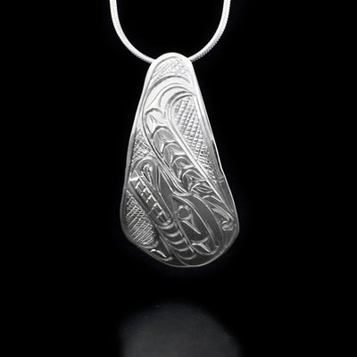 Sterling silver rounded teardrop wolf pendant.