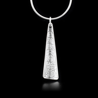 Long, sterling silver triangle pendant depicting wolf.