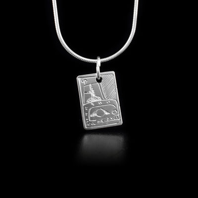 Small sterling silver rectangle pendant depicting Orca on both sides.