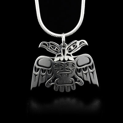 This eagle pendant depicts the front view of a two-headed eagle with outstretched wings and face on torso.
