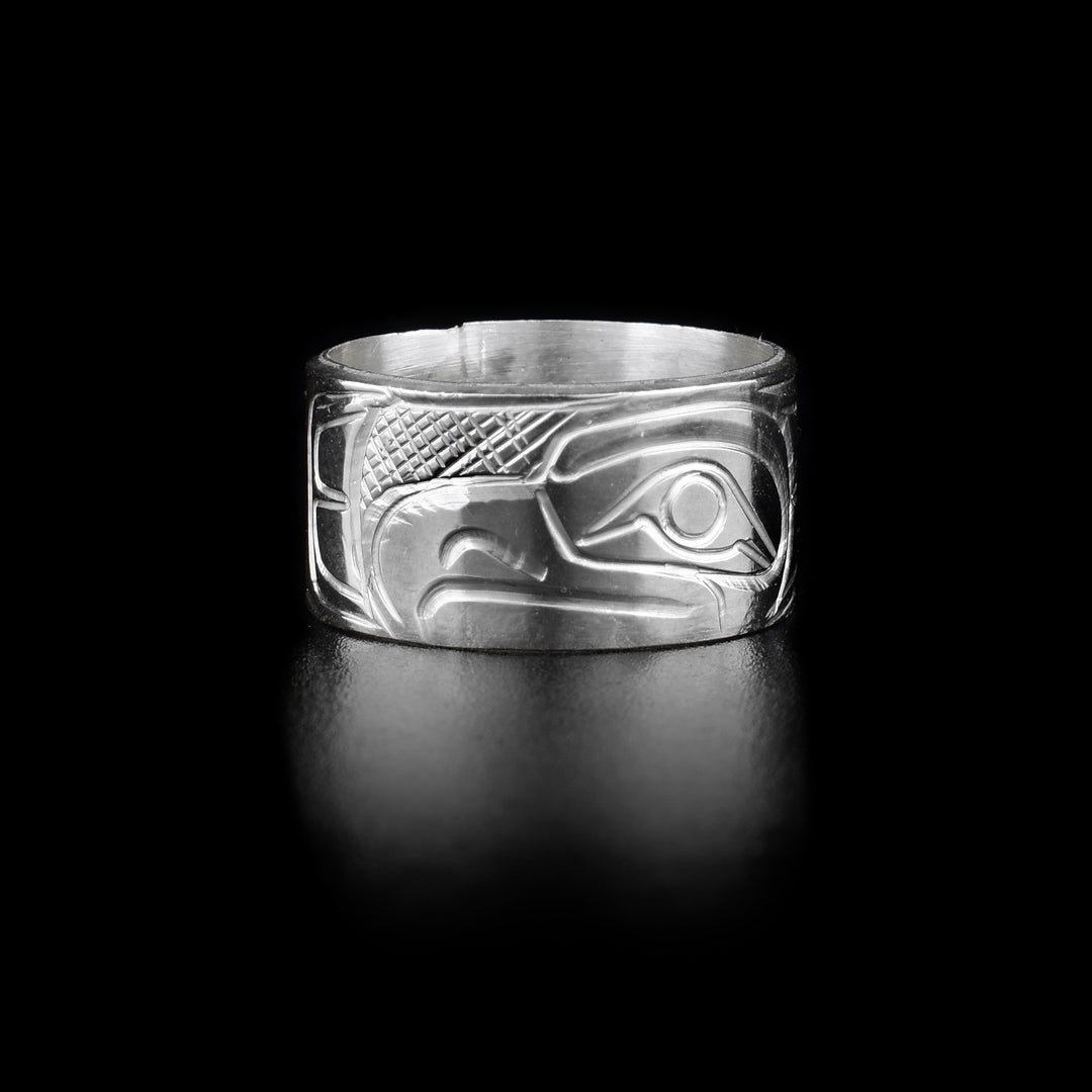 This sterling silver band ring has a chunky, single band with a depiction of the Eagle carved into it.