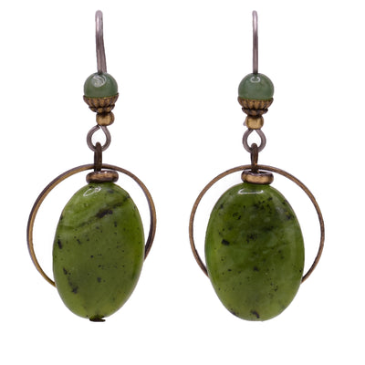 Green dangle earrings made of handworked brass and BC jade. Titanium ear hooks. By Honica.