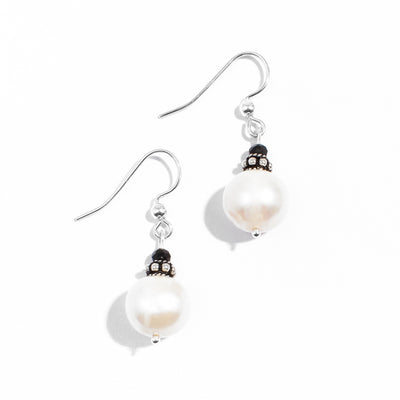 Sterling silver white freshwater pearl and black crystal dangle earrings.