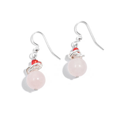 Sterling silver pink quartzite earrings with interlocking hoops adornments and translucent red beads.