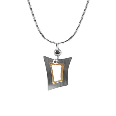 Quirky frame-like brushed and anodized aluminum pendant. Stainless steel snake chain included. By JR Franco.