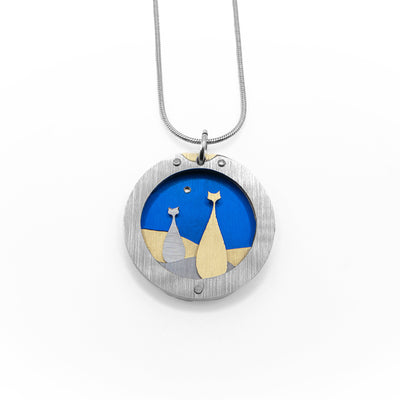 Brushed and anodized aluminum round cats on blue pendant necklace by JR Franco. Minimalist design.