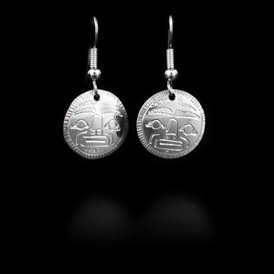 Round sterling silver dangle earrings, both depicting the moon, hand-carved by Coast Salish artist Gilbert Pat.