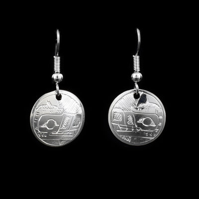 Round sterling silver dangle earrings featuring wolf heads, hand-carved by Coast Salish artist Gilbert Pat.