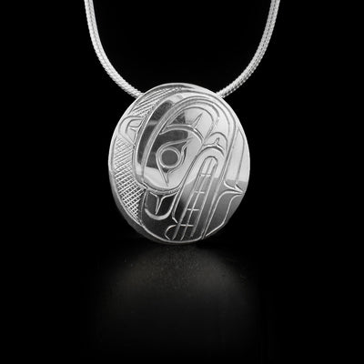 Sterling silver curved oval pendant featuring bear.