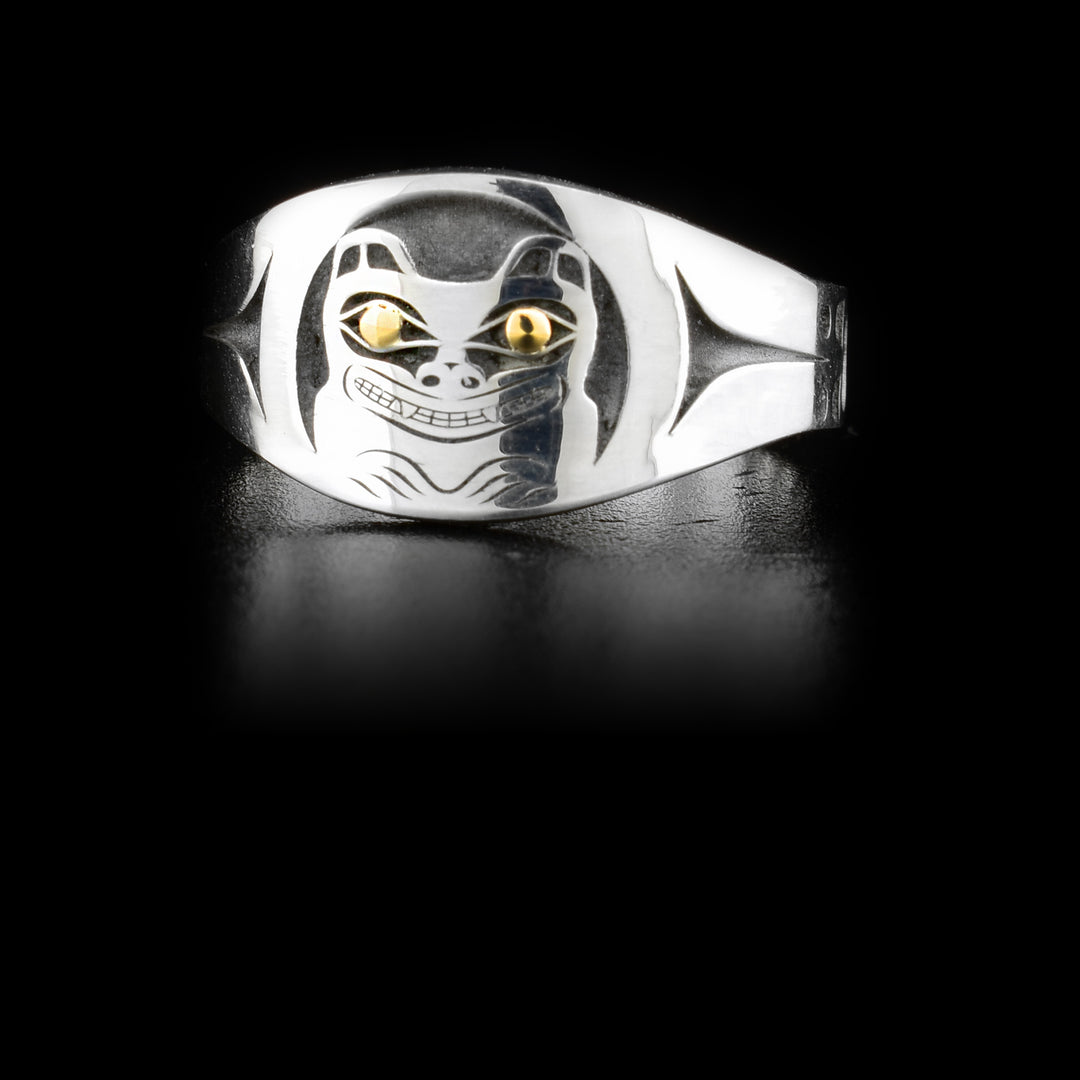 This sterling silver and 14K gold Bear signet ring has a depiction of the Bear cast into the signet. The eyes of the Bear are made from 14K gold.