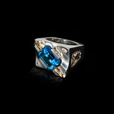 Sterling silver and 14K gold blue topaz waves statement ring by artist Ivan Dobren. Abstract design.