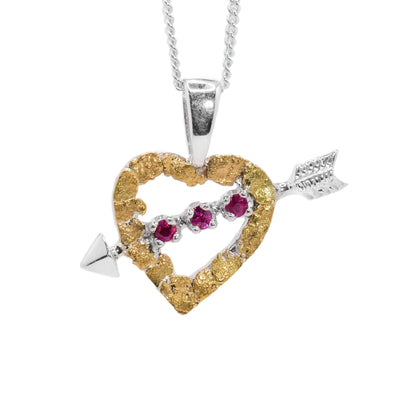 Sterling silver heart with arrow going through the middle. The heart frame is made of 22K gold nuggets. Three rubies along the arrow in the center.