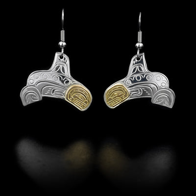 Each dangle earring features an orca with a 14K yellow gold face. Hand-carved by Kwakwaka’wakw artist William Cook.