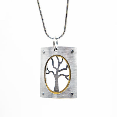 Domed, rectangular silver-colour frame with oval cut out. Grey tree inside with gold-colour outline along frame.