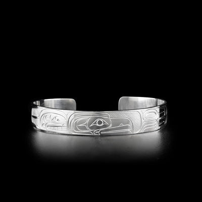 Sterling silver orca and eagle cuff bracelet. Three eighths of an inch wide. Meticulously hand-carved by Coast Salish artist Travis Henry.