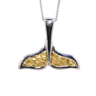 Sterling silver whale tail pendant with 22K gold nuggets in the fins. Handcrafted by Tom Gregorczyk.