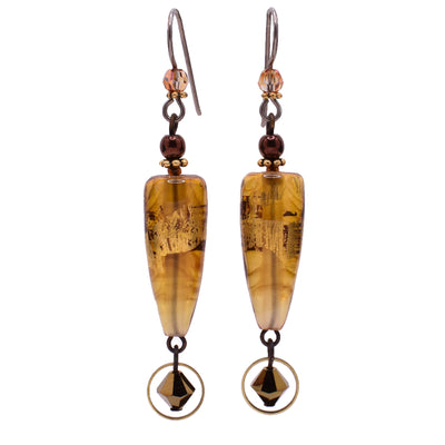 Dangle drop earrings made of Austrian crystal and BC artist studio glass with 23K gold leaf. Titanium ear hooks. By Honica.