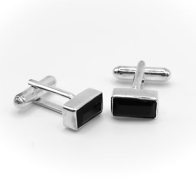 Rectangular faceted black onyx set in silver. All metal is sterling silver.