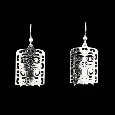 Eagle frontlet dangle earrings. Frontlets have shapes cut out. By Tahltan artist Grant Pauls.