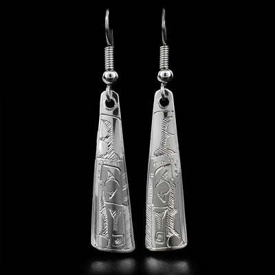 These dangle earrings are made out of sterling silver and are shaped like a long triangle. The Raven is carved at the bottom of the earrings, and is facing downwards.