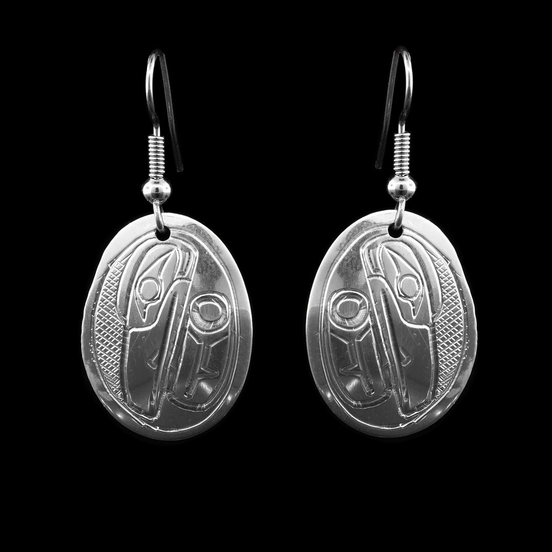 These Sterling Silver Oval Raven Earrings are hand carved with the the ravens face and beak pointed down.