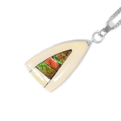 Rounded triangle pendant by Aryn Bowers. Wide pieces of fossilized mammoth ivory frame pieces of ammolite in center. Sterling silver bail. Measures 1.75” x 0.75” including bail.